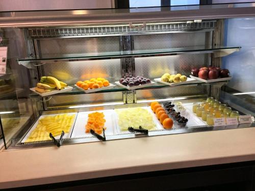 a buffet line with many different types of fruits at Hotel Byron in Rimini