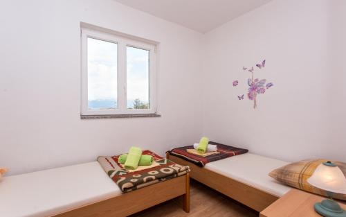 Posteľ alebo postele v izbe v ubytovaní Apartments Kraljić I