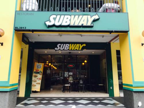 a subway entrance to a restaurant with a subway sign at USM Designer Dwell in George Town