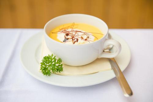 a cup of coffee with a spider on the inside of it at Hotel - Restaurant Eberlwirt in Bruckberg