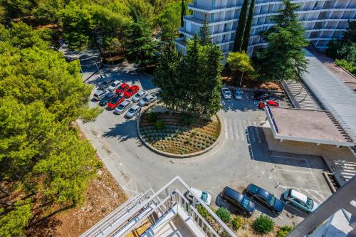 an overhead view of a parking lot with parked cars at Hotel Medena in Trogir