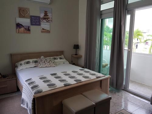 Кровать или кровати в номере Villa Bienvenue Beachfront House