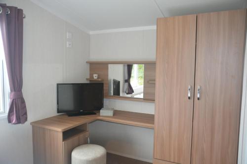A television and/or entertainment center at Weymouth Family Caravans