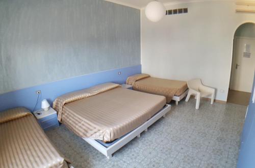 Un ou plusieurs lits dans un hébergement de l'établissement Hotel Happy