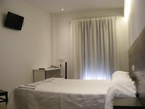 Katil atau katil-katil dalam bilik di Imprenta Musical Alojamiento
