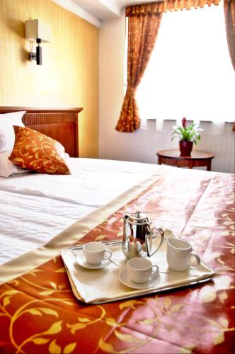 Postel nebo postele na pokoji v ubytování Actor Hotel Budapest
