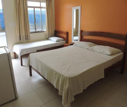 Postel nebo postele na pokoji v ubytování Pousada Raio de Sol