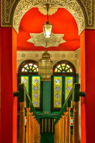 a staircase in a building with stained glass windows at Dar Ayour appartements in Essaouira