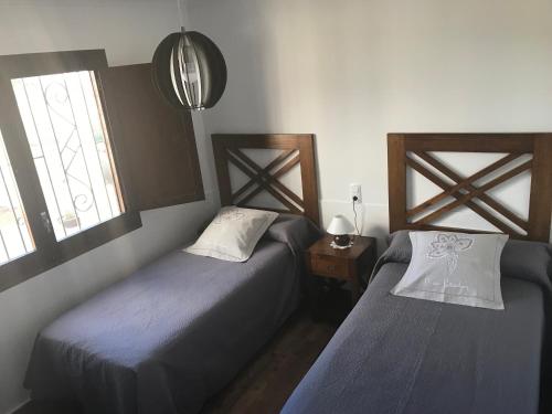 Cama o camas de una habitación en Casa rural "La Pageseta"
