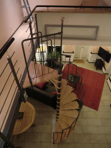 a spiral staircase in a living room at maisonette in Teltow