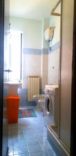 a bathroom with a toilet and a sink at A casa di Alice in Rome