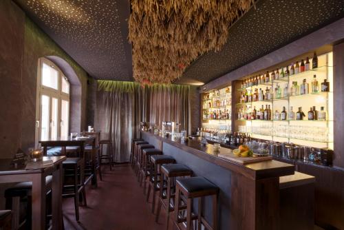 a bar with bar stools in a restaurant at Badischer Hof in Bühl
