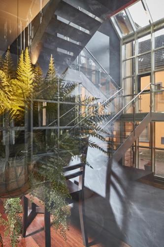 a staircase in a building with a potted plant at Badischer Hof in Bühl