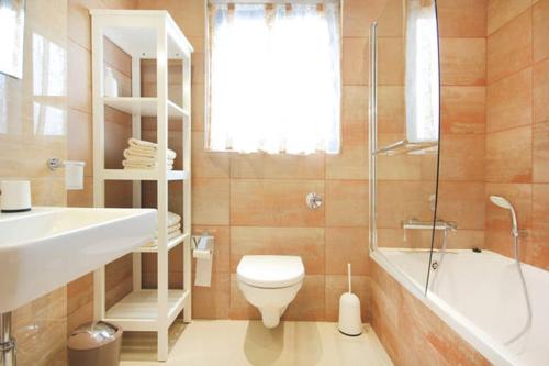 a bathroom with a sink and a toilet and a shower at Mellieha sea and land view apartment in Mellieħa