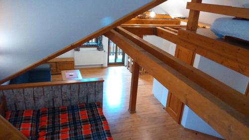 an overhead view of a room with a wooden stairs at Pension Polubný 922 in Kořenov