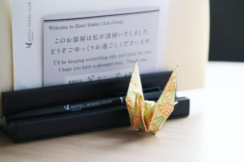 a couple of paper boats sitting on top of a box at Almont Hotel Sendai in Sendai