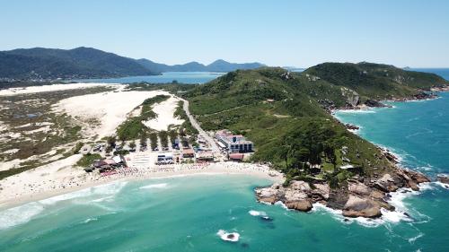 an aerial view of a beach and the ocean at Cris Hotel in Florianópolis