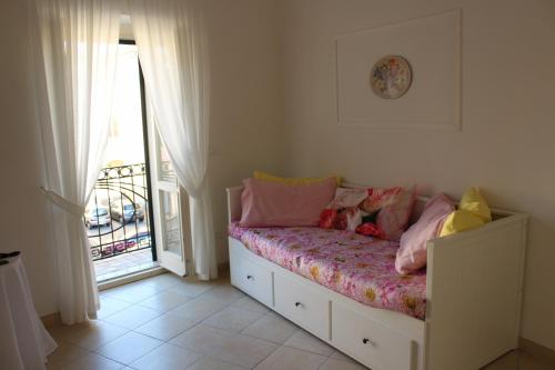 Postel nebo postele na pokoji v ubytování B&B Bouquet di fiori
