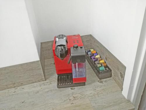 a red object sitting on the floor in a room at bianco relax in Malo