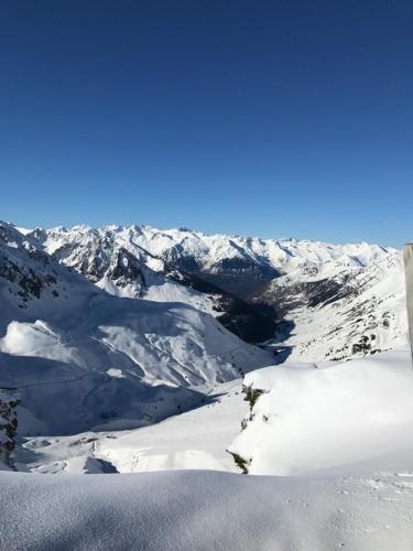 a view of a snowy mountain range with snow at Helios 105 wifi et terrasse in Barèges