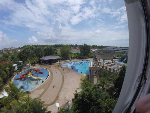 an overhead view of a pool at a resort at 3 Bedrooms at Lagoon Park Resort in Melaka