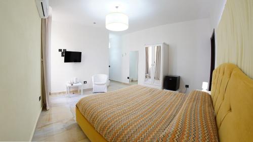 a bedroom with a large bed in a room at Beverello Suite in Naples