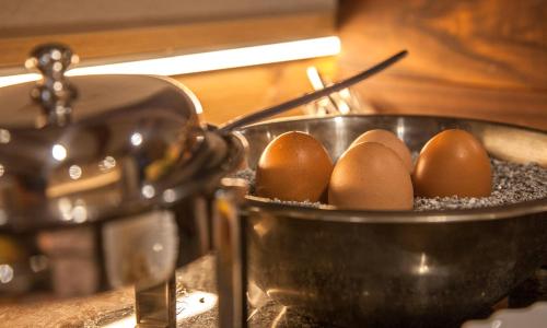 a metal pot with eggs in it on a counter at Apart Hotel Arno in Sölden