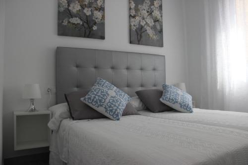 Voodi või voodid majutusasutuse Atarazana Apartment toas