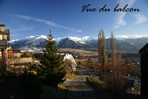 a view of a mountain range with snow covered mountains at Appartement La Marmotte in Font-Romeu