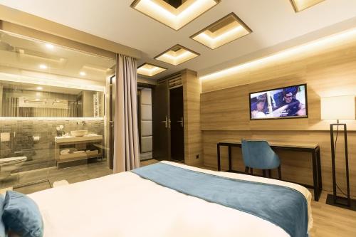 TV o dispositivi per l'intrattenimento presso Eden Luxury Suites Terazije
