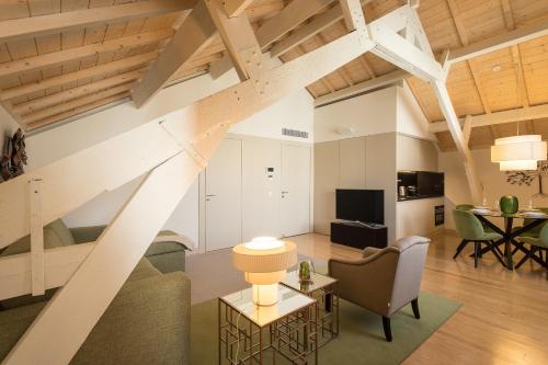 a living room with a couch and a table at Santa Catarina Apartments in Porto