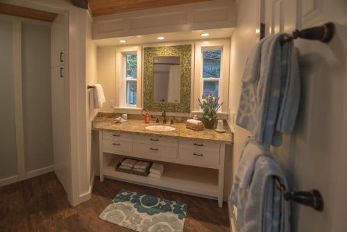 a bathroom with a sink and a mirror at Cliff House at Otter Point in Mendocino