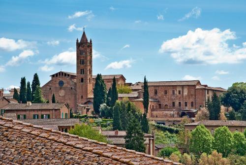 a view of a city with a clock tower at Al Mercato B&B in Siena