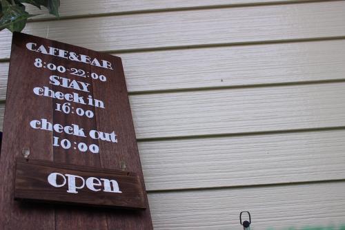 a sign on the side of a building at Nangoku Lodge Booya in Onna