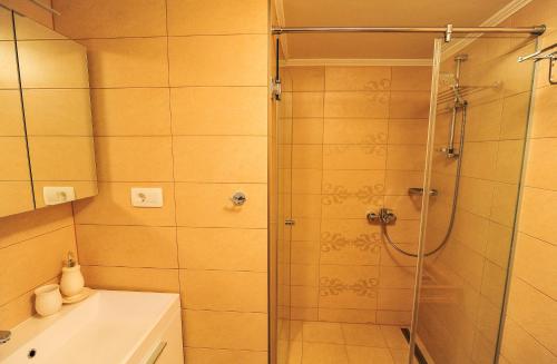 a bathroom with a shower and a sink at House Vilović Korčula in Korčula