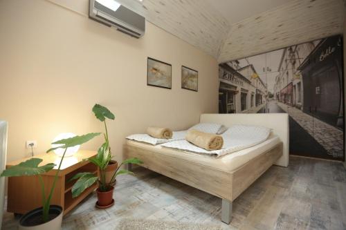 מיטה או מיטות בחדר ב-Magic Apartment