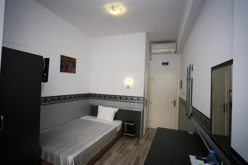Llit o llits en una habitació de Apart Hotel Central