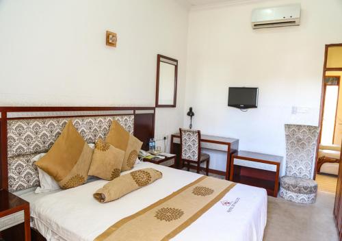 Postel nebo postele na pokoji v ubytování Hotel de Mag (Plaza)