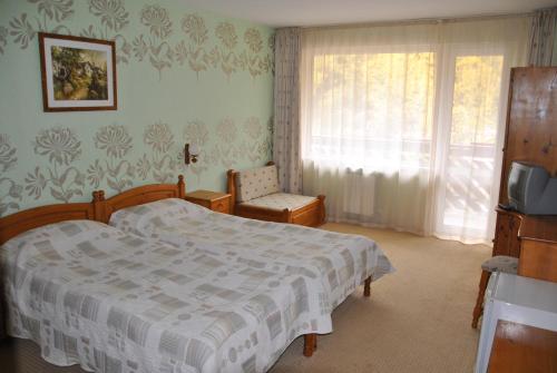 Letto o letti in una camera di Family Hotel Shoky