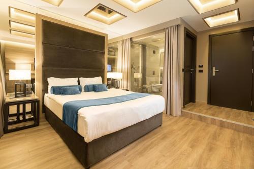 Letto o letti in una camera di Eden Luxury Suites Terazije