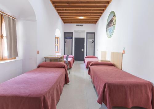 Postel nebo postele na pokoji v ubytování Albergue Inturjoven Córdoba