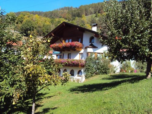 a house with flowers on the side of it at Haus Neururer in Kauns