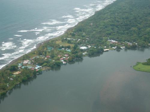 an aerial view of an island in a body of water at Casa Marbella in Tortuguero