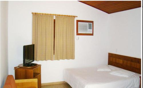 Uma cama ou camas num quarto em Hotel Baguassu