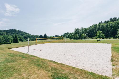 a volley ball court in a field with a goal at Resort Malevil in Jablonné v Podještědí