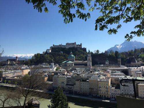 a view of a city with a castle on a hill at Apartment Krämerhaus Annaberg, Dachstein West in Annaberg im Lammertal
