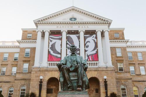 a statue of a man sitting in front of a building at The Buckingham Inn in Madison