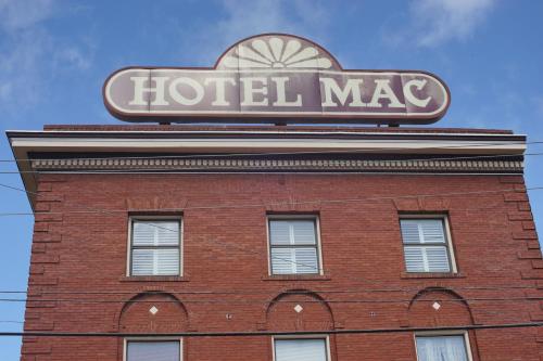 a hotel mace sign on top of a brick building at Hotel Mac in Richmond