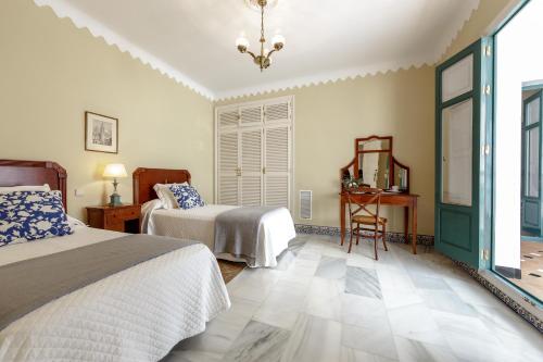 Postel nebo postele na pokoji v ubytování Casa Palacio San Jose