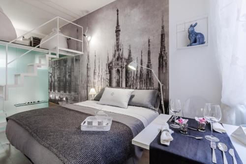 ミラノにあるスイート ブレラ マドンニーナのベッドルーム1室(ベッド1台付)が備わります。